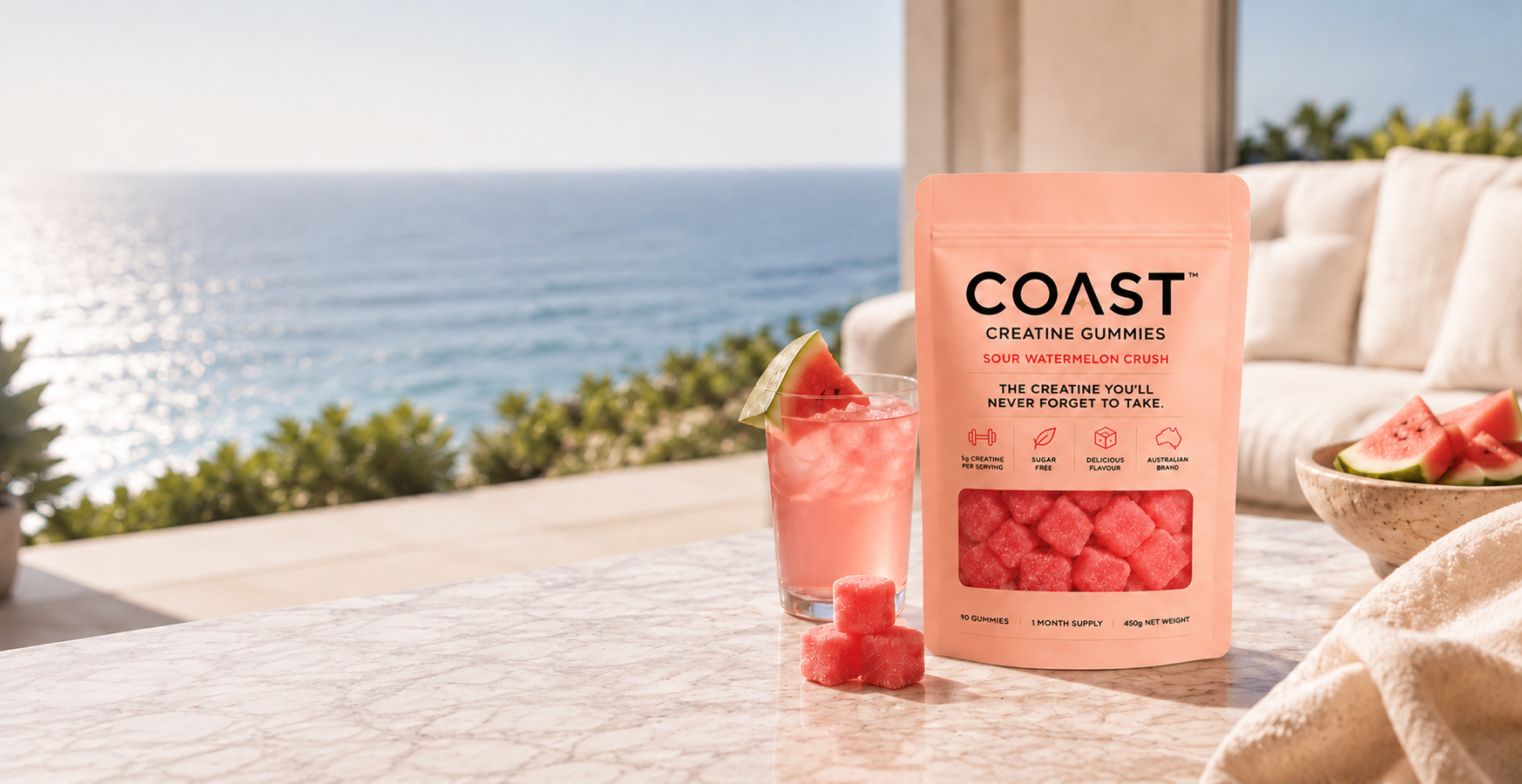COAST creatine gummies pouch on a marble table by the ocean