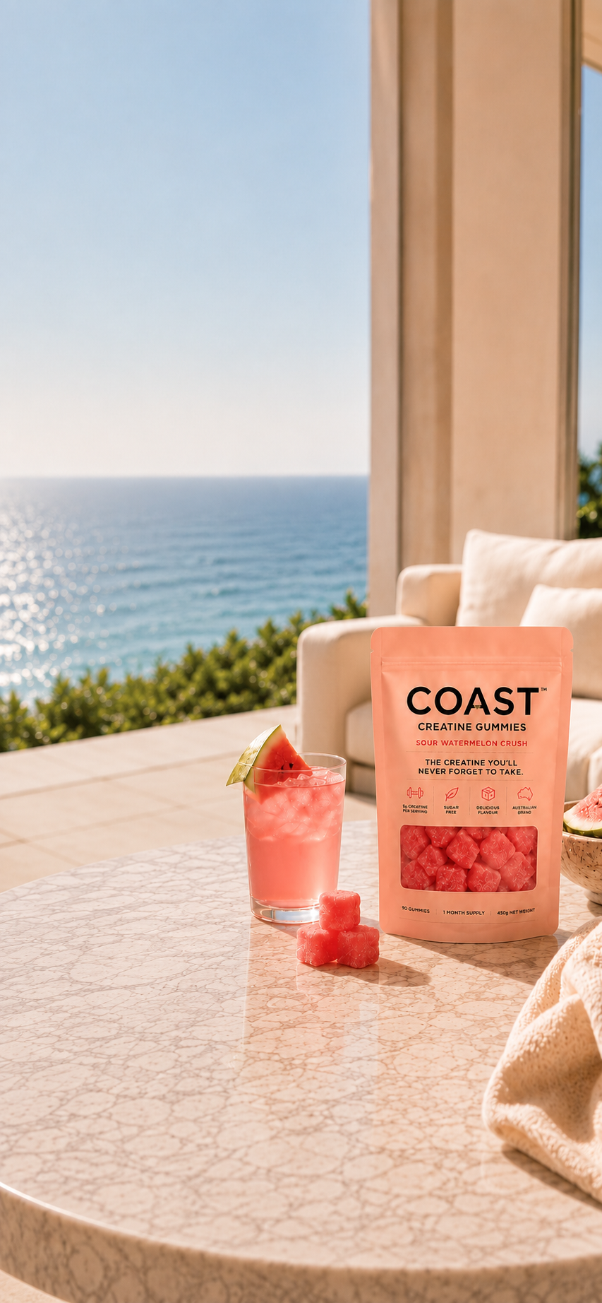 COAST creatine gummies pouch on a marble table by the ocean